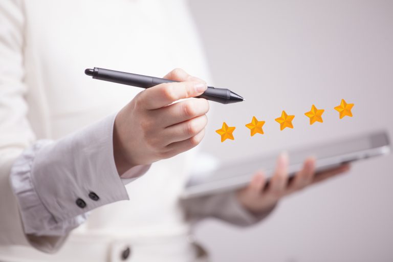 Five star rating or ranking, benchmarking concept. Woman assesses service, hotel, restaurant
